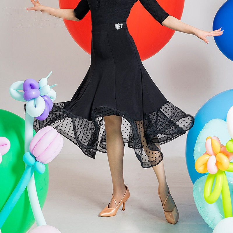 Black ballroom dance skirt with dotted mesh hem band, hip and hem view