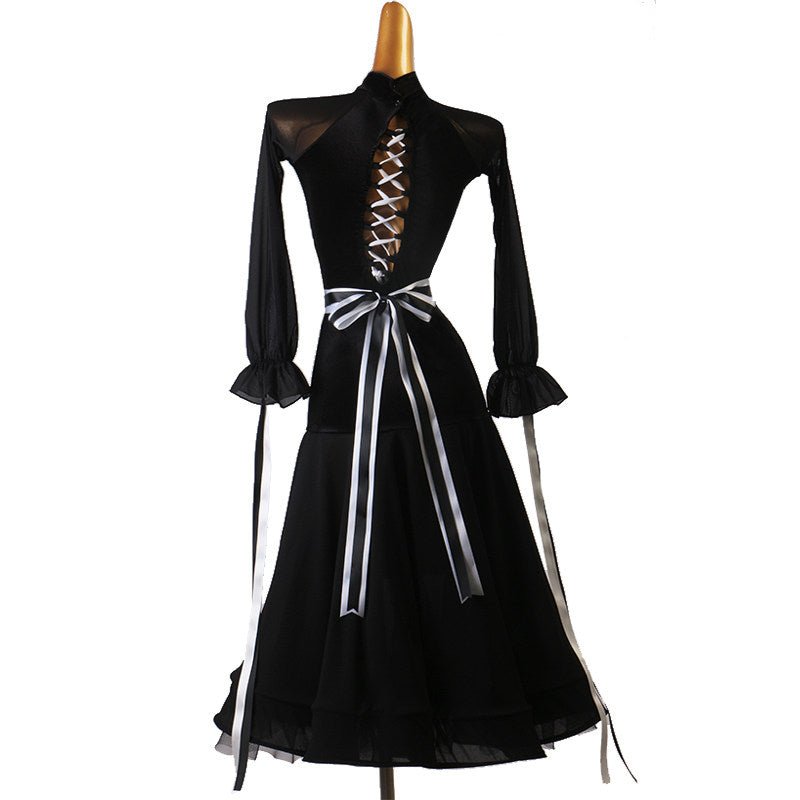 Black dance dress back view showing the white ribbon corset lacing and long ties