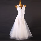 White ballroom competition dress with a beaded empire waist and draped bodice