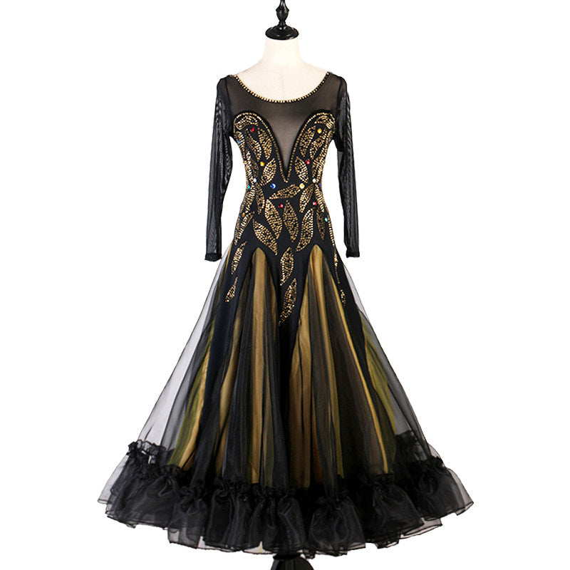 Gold and black ballroom dance dress with lace applique bodice on mannequin