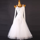 White ballroom competition dress with a diagonal rhinestone band and tulle skirt