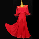 Red ballroom dance dress with shoulder ruffle and feather-trimmed elbow sleeves on mannequin