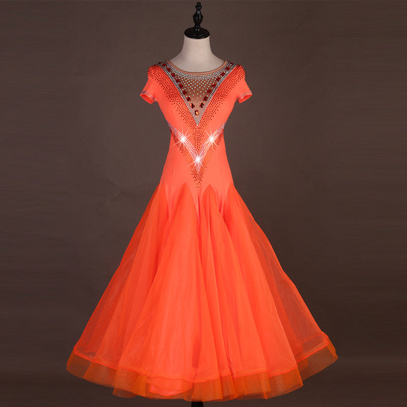 Orange ballroom dress with crystal illusion neckline and cap sleeves on mannequin