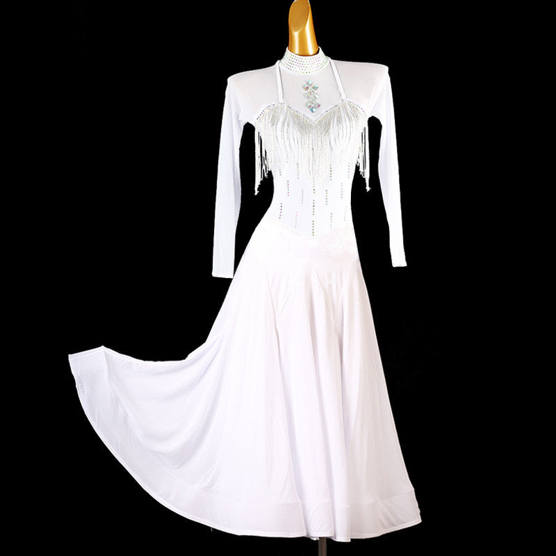 White ballroom competition dress with beaded fringe shoulders and a stone collar