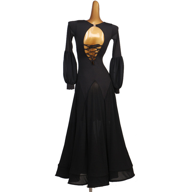Black ballroom dress back view showing the corset lace-up open back and lantern sleeves