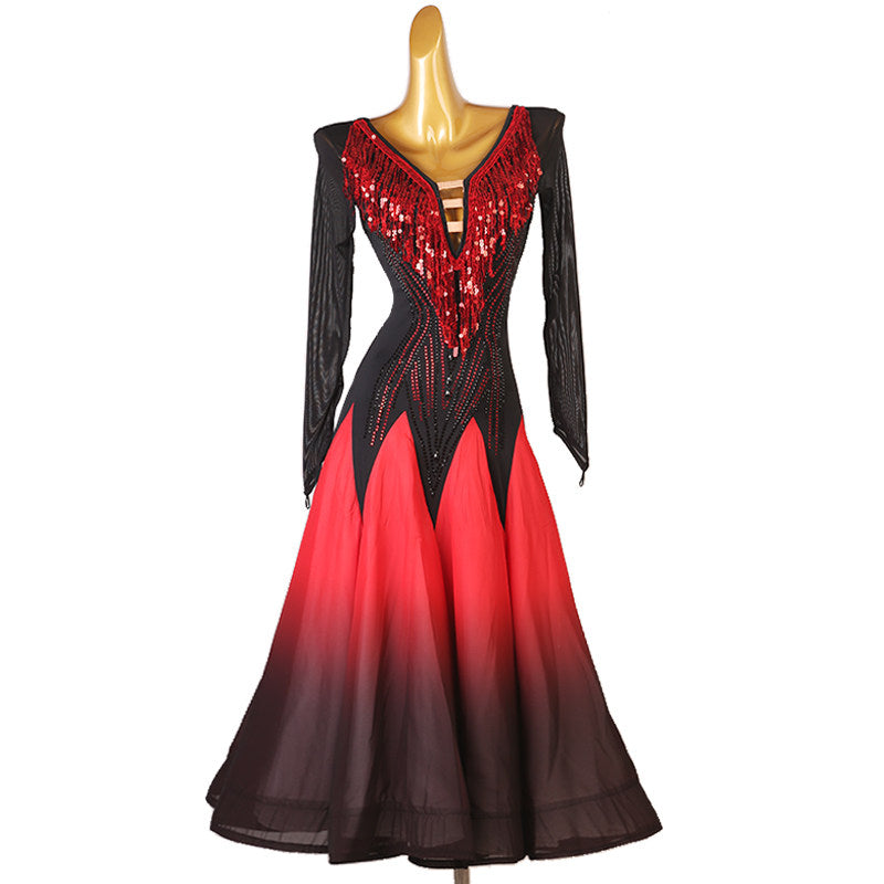 Red and black ballroom competition dress with a sequin bodice panel and mesh sleeves