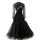 Black ballroom dance dress with rhinestone swirl bodice on mannequin