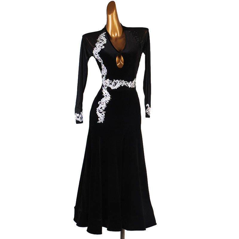 Black velvet ballroom competition dress with ivory scroll applique on the bodice