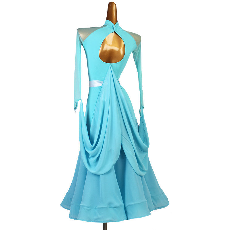 Back view of the light blue ballroom dress with the mock neck keyhole and hip drape