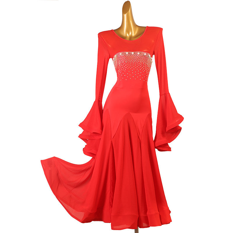 Red ballroom competition dress with a rhinestone band across the illusion bodice