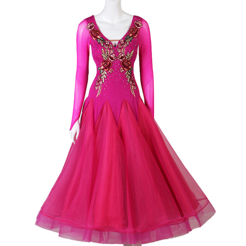 Fuchsia ballroom dance dress with embroidered rose bodice on mannequin