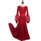 Red ballroom dress with mesh yoke and organza lantern sleeves, skirt sweeping to the side