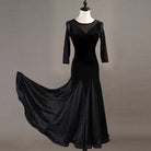 Black velvet ballroom dress with mesh yoke and fishtail skirt swept out