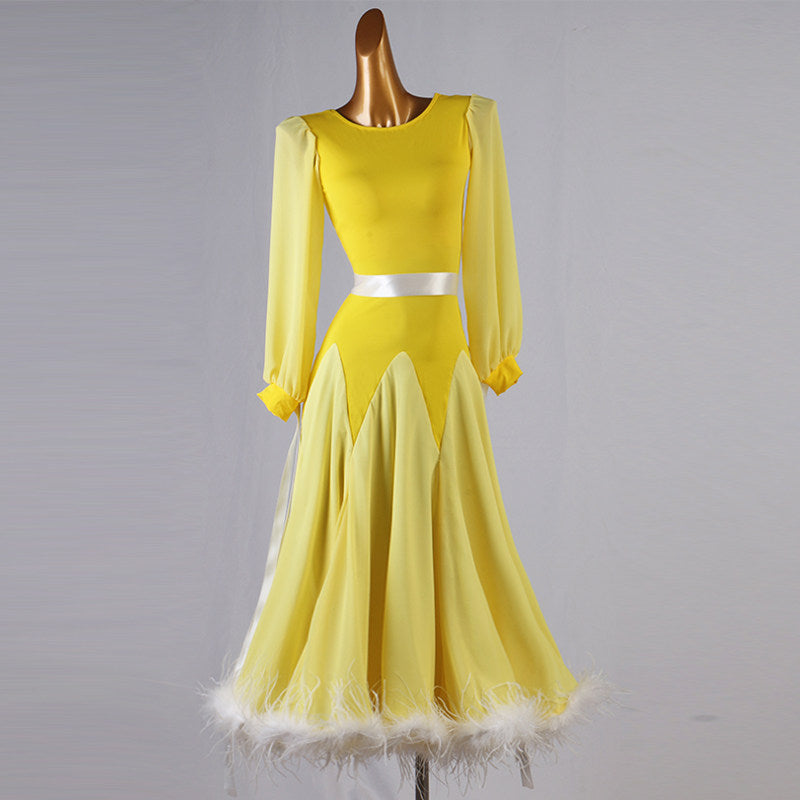 Yellow ballroom dance dress with white feather hem and sheer lantern sleeves