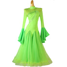 Neon green ballroom competition dress with a rhinestone bodice and tiered sleeves