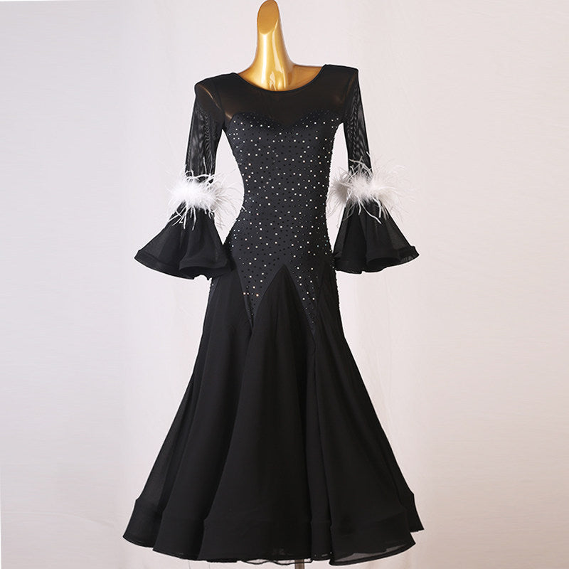 Black ballroom competition dress with white feather trimmed bell cuffs
