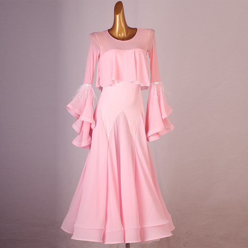 Pink ballroom practice dress with a cape ruffle and tiered ruffle sleeves