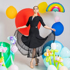 High waist black ballroom practice skirt with dot mesh hem seen from the front