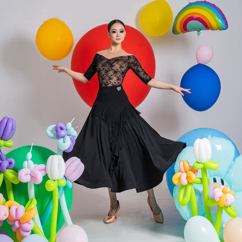 Black front ruffle cascade ballroom practice skirt swept wide through a turn