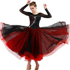 Black and red ballroom competition dress shown mid turn on a dancer