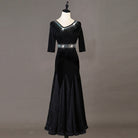 Black ballroom dance dress front view with fitted satin hip