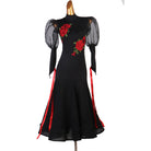 Black ballroom dress with red rose applique, sheer puff sleeves and hip ribbon streamers