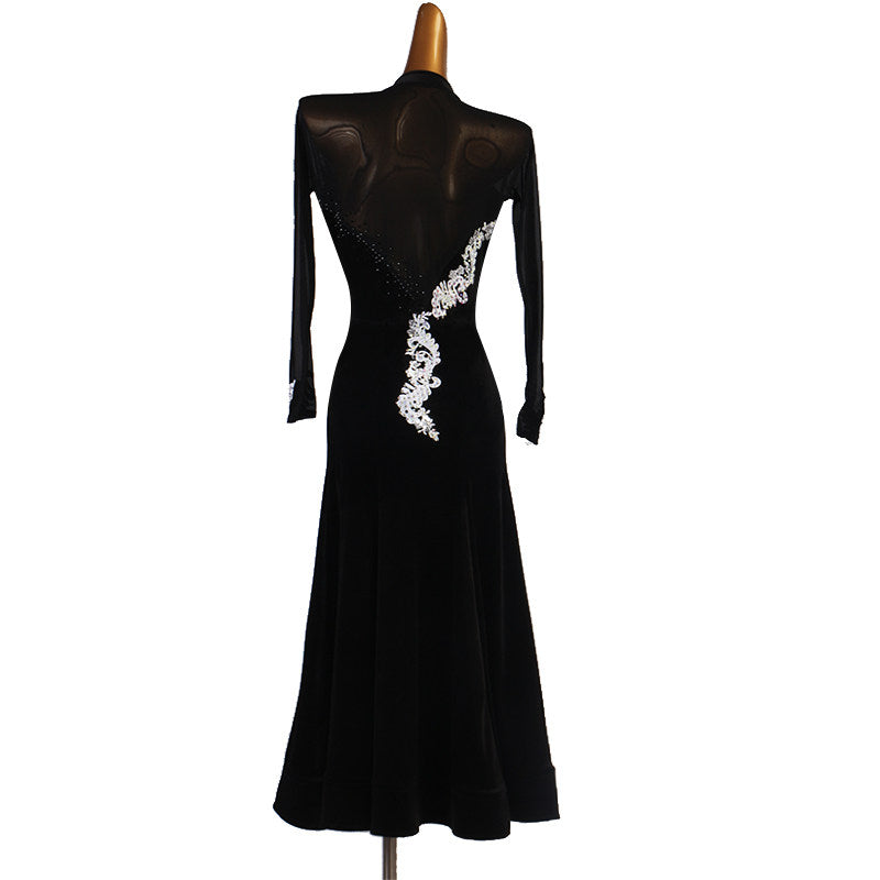 Back view of the black velvet dance dress showing the sheer mesh back panel