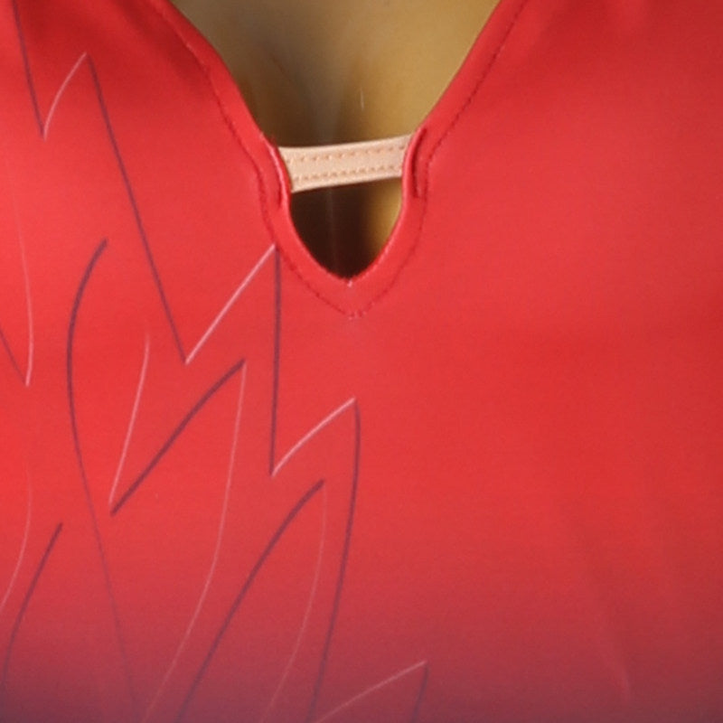 Close up of the keyhole at the point of the ruched red V neckline