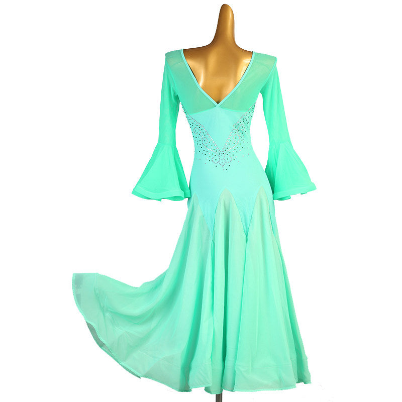 Mint green ballroom dress with the godet skirt swept out to the side