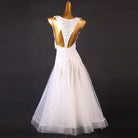 Back view of the white beaded empire waist dress showing the deep open back
