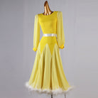 Yellow feather trim dance dress front view with the chiffon skirt hanging straight