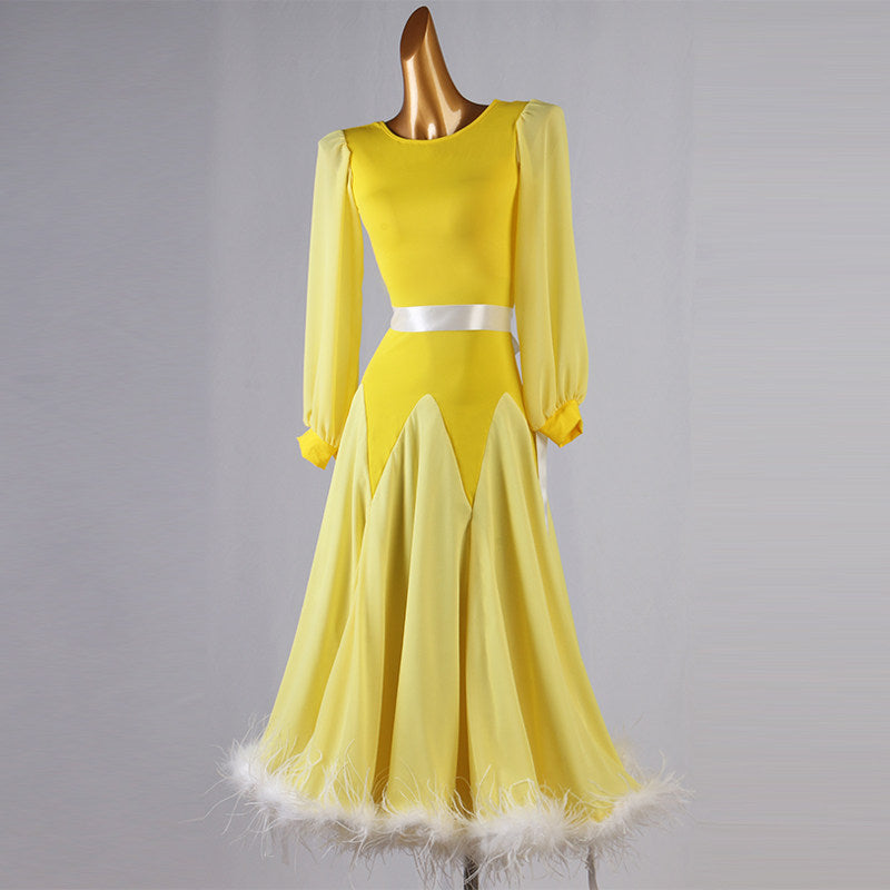 Yellow feather trim dance dress front view with the chiffon skirt hanging straight