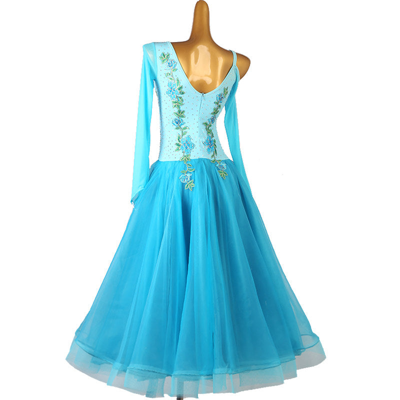 Turquoise ballroom dress back view showing the open V back and sheer sleeve