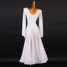 White dance dress back view showing the deep V and the flared sleeve panels hanging