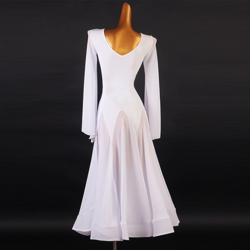 White dance dress back view showing the deep V and the flared sleeve panels hanging