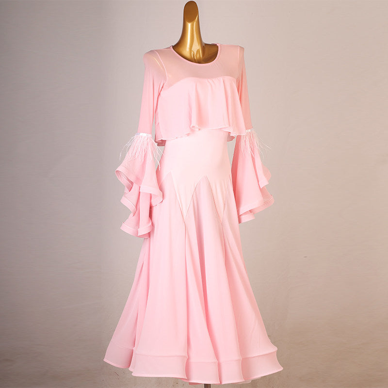 Pink cape ruffle practice dress front view with the godet skirt hanging