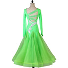 Back view of the green ballroom dress showing the crossed strappy open back
