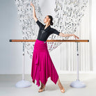 Fuchsia pointed hem ballroom practice skirt swept out through a turn