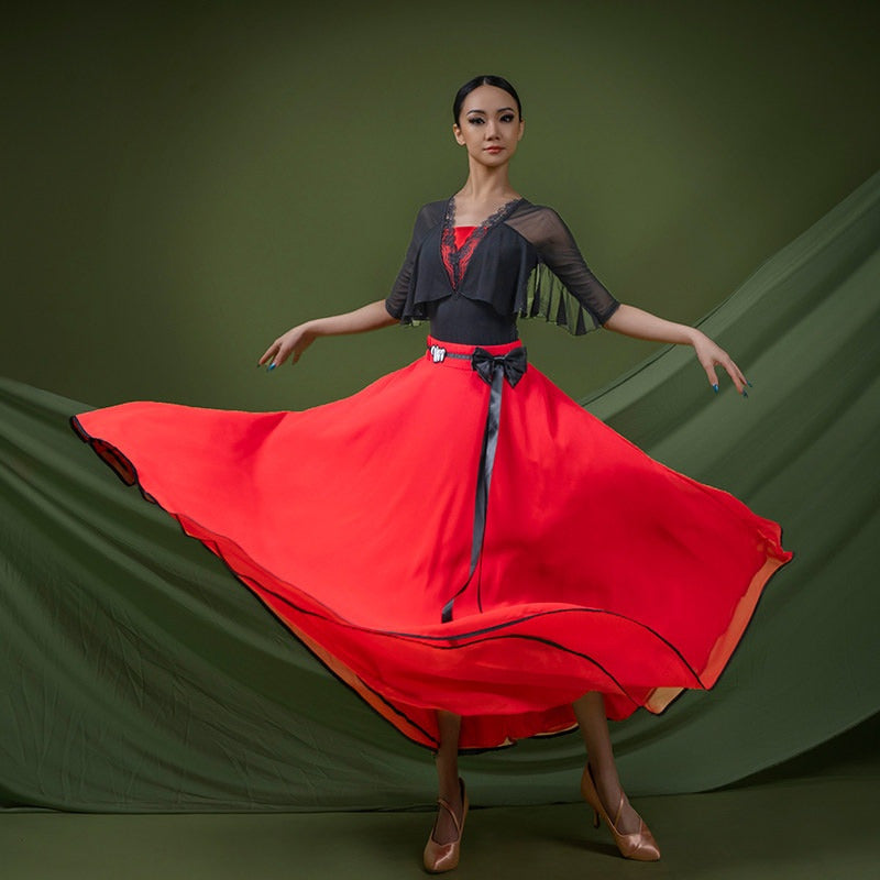 Red satin trimmed ballroom skirt swept wide through a turn