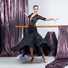 Black lace insert ballroom practice skirt flaring through a turn with pointed hem panels