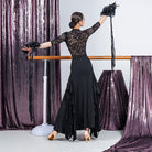 Back view of the black ruched waist ballroom dance skirt with lace insert side ruffles