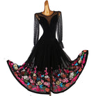 Black ballroom dance dress with the embroidered hem sweeping wide on a turn