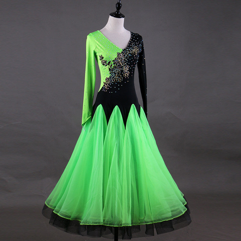 Green ballroom gown with asymmetric gold embroidered bodice and organza skirt