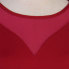 Close up of the sheer mesh V yoke on the red ballroom practice dress