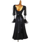 Black practice dress showing the ruffled lace sleeve cuff