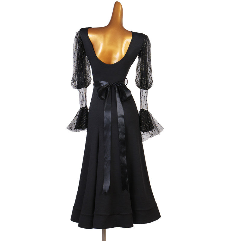 Black practice dress showing the ruffled lace sleeve cuff
