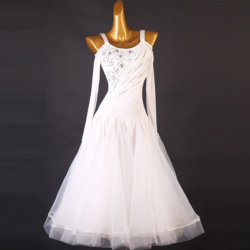 White ballroom dress with the sheer sleeve hanging beside the tulle skirt