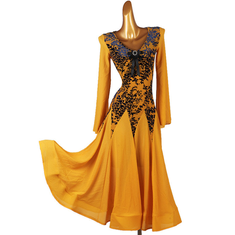 Golden ballroom dance dress with the godet skirt sweeping across the floor