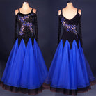 Blue ballroom competition dress with rhinestone flame bodice on black velvet