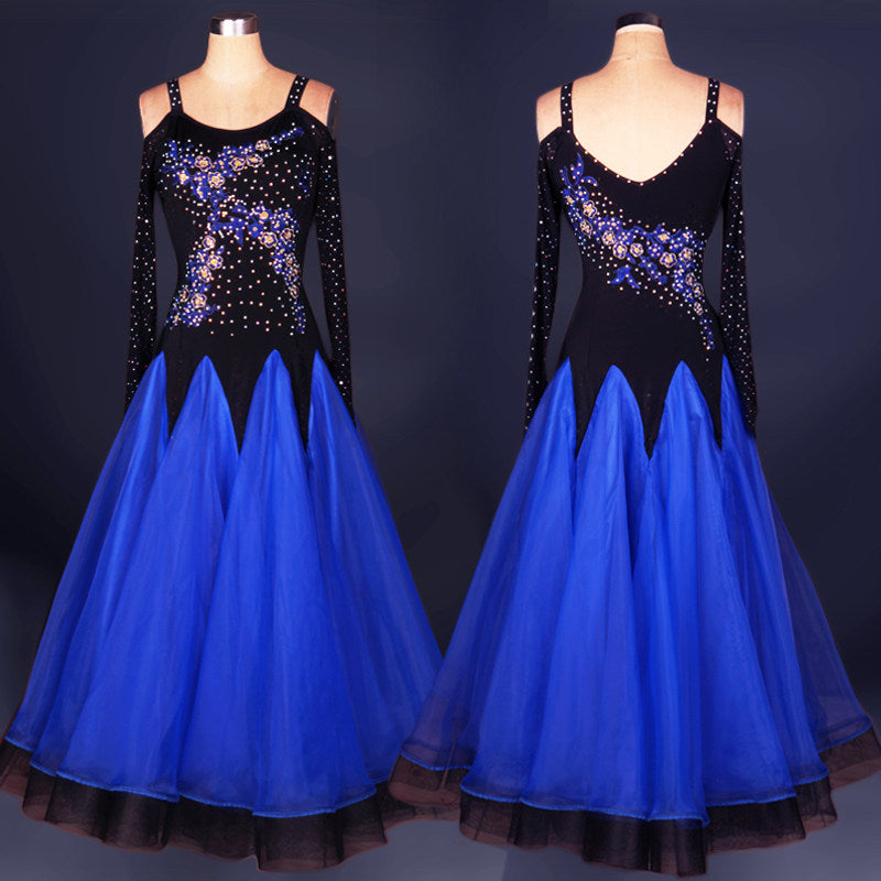 Blue ballroom competition dress with rhinestone flame bodice on black velvet
